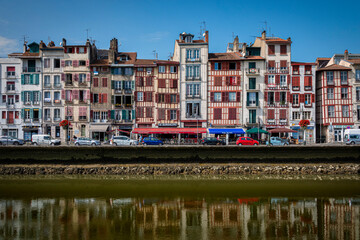 Obraz premium Traditional facades with colorful windows in Bayonne, Basque Country, France
