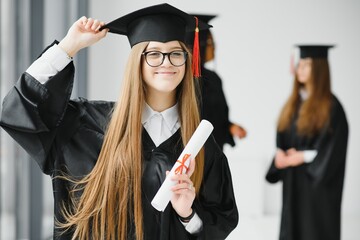 Woman portrait on her graduation day. University. Education, graduation and people concept.