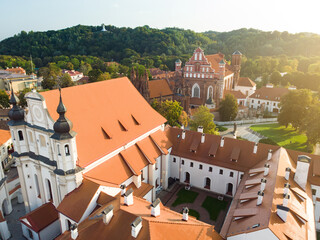 Aerial view of Vilnius Old Town, one of the largest surviving medieval old towns in Northern Europe. Summer landscape of UNESCO-inscribed Old Town of Vilnius, the heartland of the city. - obrazy, fototapety, plakaty