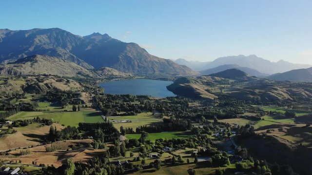 Aerial pull back of Double Cone mountain and Lake Hayes. New Zealand landscape