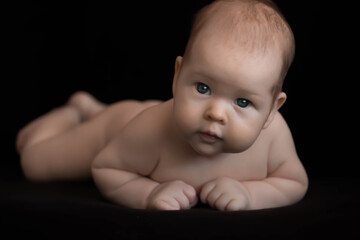 baby on black background