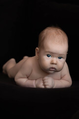 baby on black background