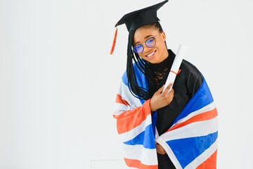 Beautiful African-American girl with flag of Great Britain as background. Learning English