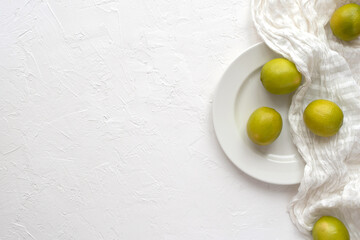 Lime on a plate on a white background