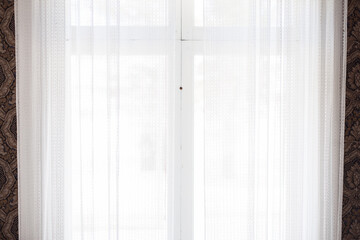 White curtains in front of window
