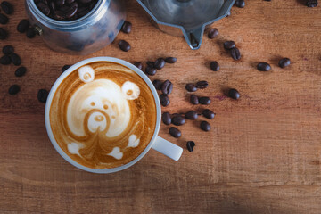 Hot cappuccino art with fresh coffee bean on table.
