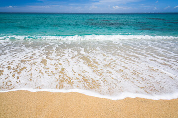 Ocean waves, beach, and blue sky in Taitung, Taiwan.