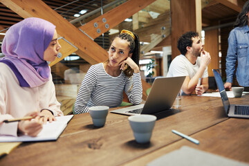 Young businesswomen talking together during a meeting