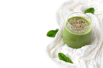 green smoothie in a glass on a white background