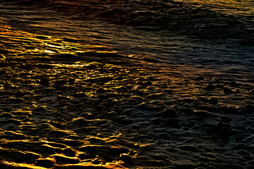 Beautiful yellow sunset reflected in the sea