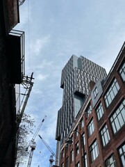 Obraz premium Looking up at modern buildings in Manchester City centre. Taken in Manchester England. 
