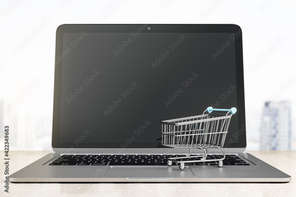 Poster shopping online on website concept with blank monitor and small shopping cart on laptop. mockup