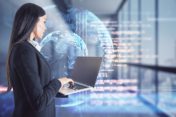 Coding and big data concept with businesswoman typing on laptop keyboard and digital screen with world planet and programming code