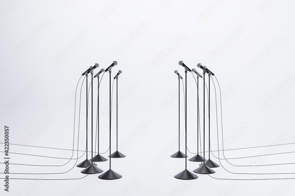 Poster speaking performance concept with microphones standing in a circle on light background