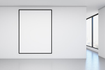 Blank poster on a blank white wall in an office room. Mockup
