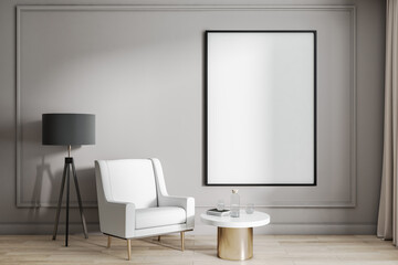 Obraz na płótnie Canvas Blank white poster in black picture frame on light grey wall in modern style cabinet with white armchair, black lamp and coffee table. Mockup