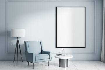 Blank white poster in black picture frame on light wall in modern style room with stylish armchair, white and black lamp and coffee table. Mockup