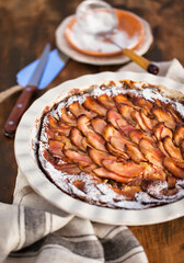 Homemade delicious apple pie, top view, wooden backdrop