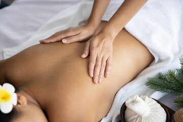 View of Woman Back Receiving Back Massage Treatment From the Masseur  in a Spa