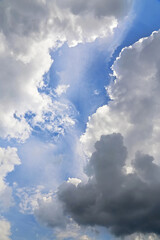 gap of blue sky between the clouds