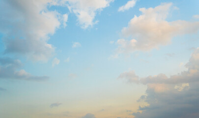 Beautiful view of blue sky with clouds at sunrise. Partly cloudy. Colorful sunset. Natural sky background texture, beautiful color.