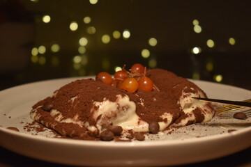 tiramisu with fairy lights in the background