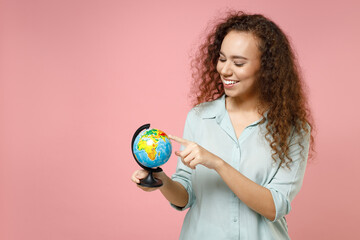 Young black african american smiling fun happy geography student curly woman 20s wearing blue shirt...