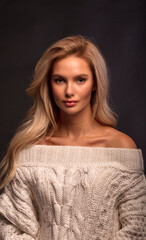 Blonde, studio portrait of a young girl