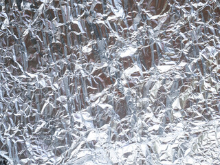 Crumpled metal foil texture background, aluminum foil texture
