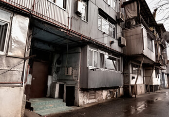 Fototapeta na wymiar Batumi, Georgia - March 10, 2021: Entrance of an old house in a poor house