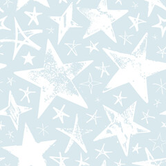 Seamless pattern with white hand drawn vector stars isolated on light blue background. 