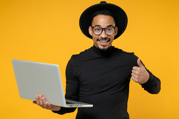 Young freelancer smiling copywriter african man 20s wear stylish black shirt hat eyeglasses using...