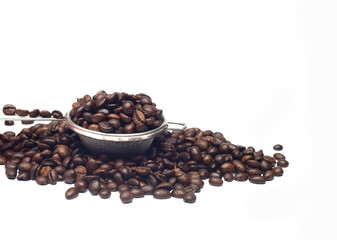 dark roasted coffee beans on a white background