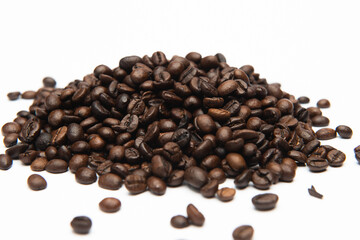 dark roasted coffee beans on a white background