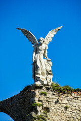 Sculpture of a Guardian angel with a sword in the cemetery of Comillas. Cantabria, Spain