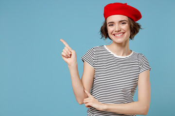 Young happy fun european woman 20s with short hairdo wearing french beret red hat striped t-shirt...