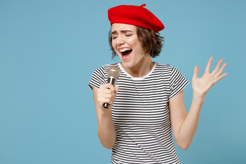 Young singer woman 20s with short hairdo wearing french beret red hat striped t-shirt singing song...