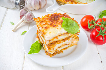Mediterranean food, Italian traditional lasagna pasta, with bolognese, bechamel and cheese. On white kitchen table background