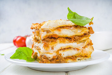 Mediterranean food, Italian traditional lasagna pasta, with bolognese, bechamel and cheese. On white kitchen table background