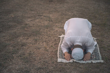 Fototapeta na wymiar Asian white islam man prayer,Young Muslim praying,Ramadan festival concept