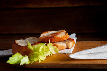 toasted white bread with herbs on a table background.