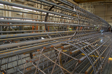 Production of iron structures in the factory, large-scale construction workpieces made of metal.