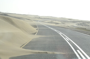 A sandstorm coveres the street in namibia