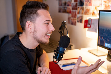 Young man recording podcast or voiceover 