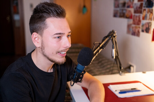 Young Man Recording Podcast Or Voiceover 