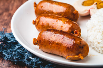 Pinoy Breakfast Meal- Longganisa with Salted Egg and Steamed Rice (close up)