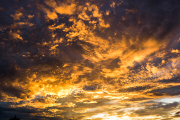 Colorful beautiful sunset with the orange cloud background