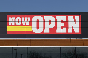 Now Open sign above a new neighborhood business.