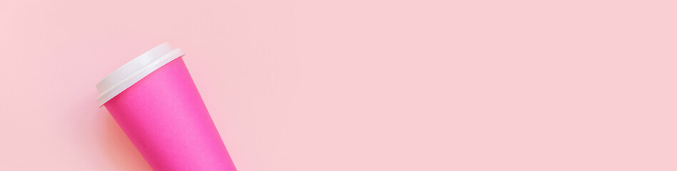 Simply flat lay design pink paper coffee cup on pink pastel colorful background. Takeaway drink container. Good morning wake up awake concept. Template of drink mockup. Top view copy space, banner