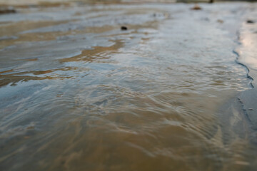 Part of dirty river with polluted water flowing somewhere in distant and abandoned area where no life is possible because of toxicity